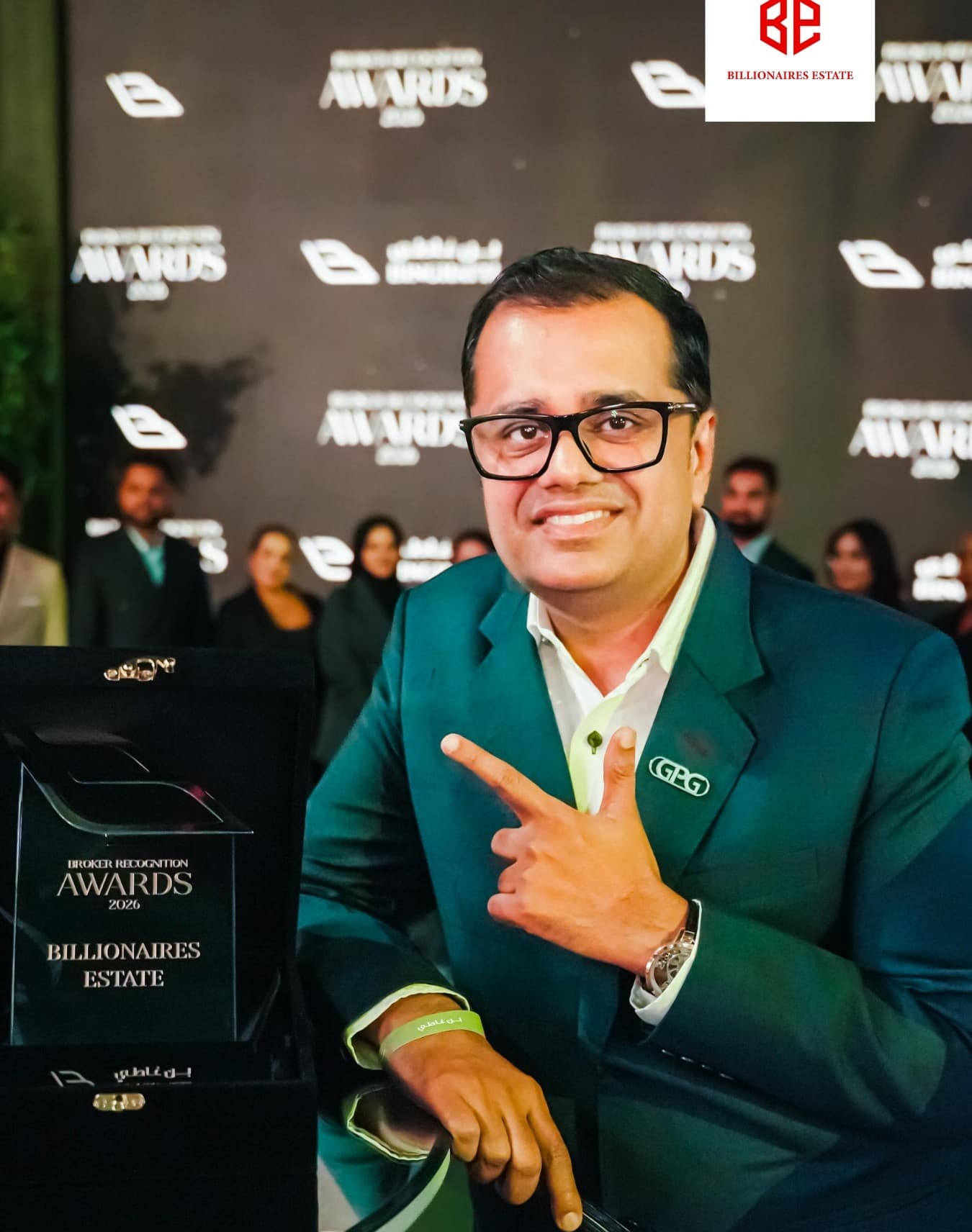 GPG team member with Billionaires Estate award trophy