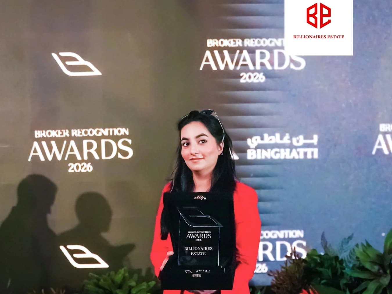 GPG representative holding Binghatti Broker Recognition Award 2026
